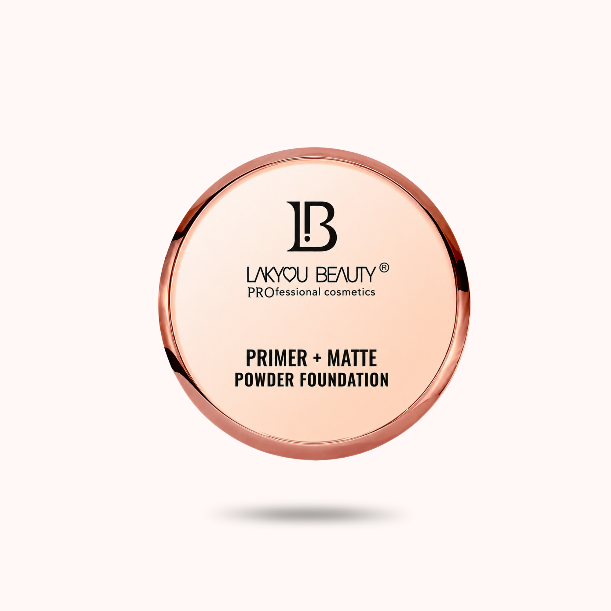 A round makeup compact for liquid or powder foundation with a rose gold metallic rim and a pale pink pressed powder visible inside. The brand name 'LAKYOU BEAUTY' is printed in black on the lid, along with the text 'PRIMER + MATTE POWDER FOUNDATION'.