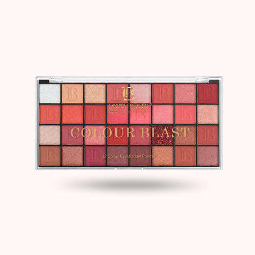 A 32-shade eyeshadow palette named 'COLOUR BLAST' by Beauty Creations, displayed open against a light off-white background with a soft drop shadow.